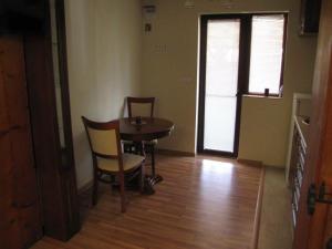 a small dining room with a table and chairs at Guest House Vergie in Sapareva Banya