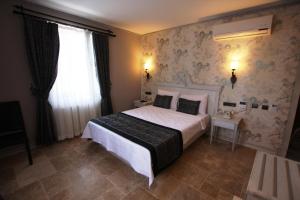 Postelja oz. postelje v sobi nastanitve Assos Behram Special Class Hotel Adults Only