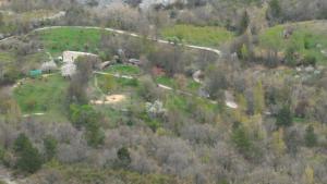 an aerial view of a house on a hill at Ferme La Viste in La Roche-sur-le-Buis