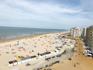 a beach with a lot of people on it at Apartment S7 in Ostend