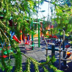 a park with a playground with a play area at Abro in Augustów