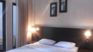 Voodi või voodid majutusasutuse RF Hotel toas