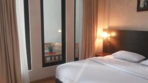 Voodi või voodid majutusasutuse RF Hotel toas