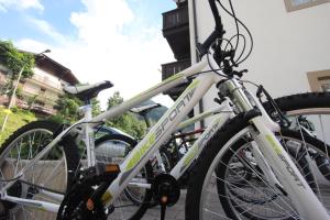 a group of bikes parked next to a building at Hotel Fanes Suite & Spa in Moena