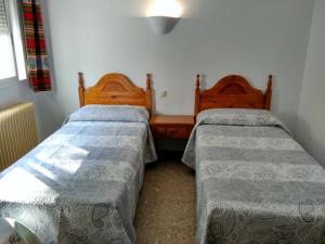 Postel nebo postele na pokoji v ubytování Pensión Rural Arroyo la Teja