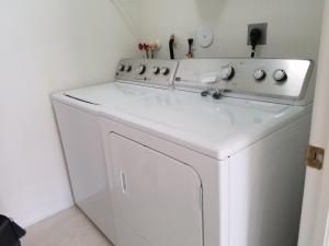 a white washer and dryer in a room at My Florida Lake House in Homestead +26 photos