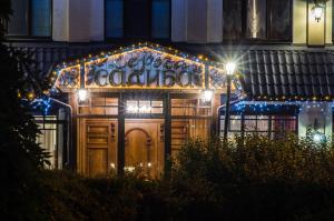 a house with lights on the front of it at Lepsza Садыба in Bila Tserkva