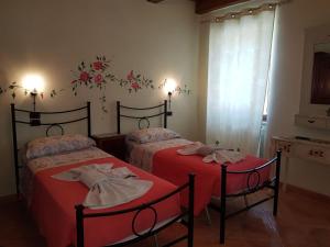 A bed or beds in a room at B&B Antica Fonte del Latte