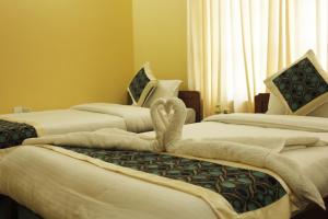 Uma cama ou camas num quarto em Hotel Nana Pokhara