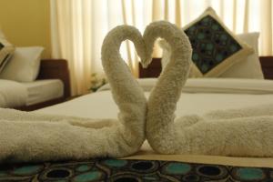 Uma cama ou camas num quarto em Hotel Nana Pokhara