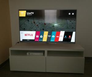 A television and/or entertainment centre at Talia Ortigia Apartment