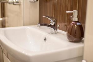 A bathroom at Take your time Apartment