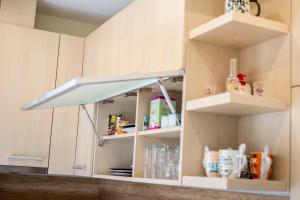 A kitchen or kitchenette at Take your time Apartment