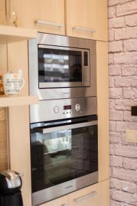 A kitchen or kitchenette at Take your time Apartment