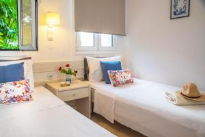 Posteľ alebo postele v izbe v ubytovaní Melissa Apartments, Studios & Suites