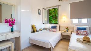 Posteľ alebo postele v izbe v ubytovaní Melissa Apartments, Studios & Suites