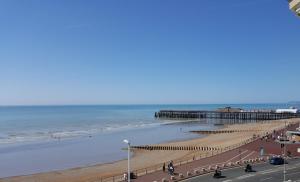 a view of a beach with a pier at Chatsworth Hotel in Hastings