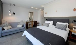 Postel nebo postele na pokoji v ubytování Minoa Hotel