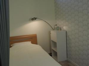 Postel nebo postele na pokoji v ubytování Guesthouse ORI ORI