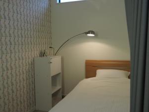 Postel nebo postele na pokoji v ubytování Guesthouse ORI ORI