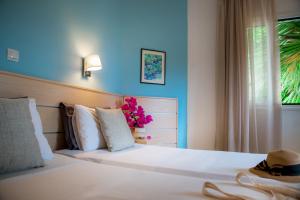 Posteľ alebo postele v izbe v ubytovaní Melissa Apartments, Studios & Suites