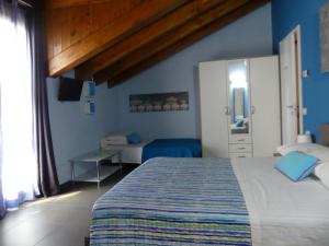 Ένα ή περισσότερα κρεβάτια σε δωμάτιο στο I Fiori di Malpensa