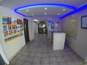 a hallway with a blue light in a room at Asty Hotel in Nicosia