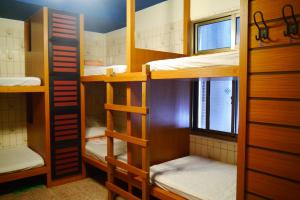 Palanda nebo palandy na pokoji v ubytování Hsin Hsin Hotel