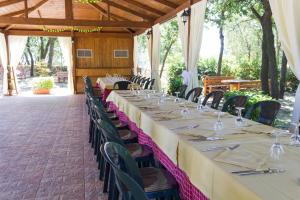 a set of tables and chairs in a pavilion at Agriturismo Fasano in Cassano delle Murge