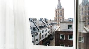 a view of a city from a window at Hotel Sion in Cologne