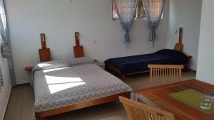 Postel nebo postele na pokoji v ubytování Casa Patio
