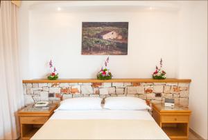 A bed or beds in a room at Hotel Terminal - Caroli Hotels