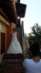 a bride walking up the stairs of a building at Villa Salvatore in San Leone