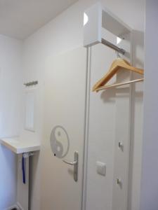 a kitchen with a refrigerator and a sink at Schnuckelig und Fein in Oberstaufen