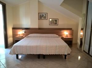 Кровать или кровати в номере Hotel Rocco