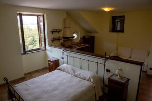 a bedroom with a bed and a sink and a window at Milordrelais in Massa Lubrense