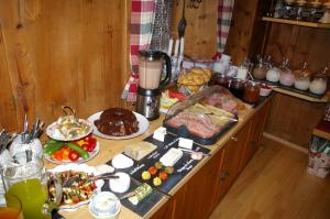 a table with food and a blender on it at Thalerhof in Roppen