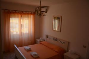 Cama o camas de una habitación en Andreina a San Pietro Apartment
