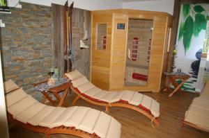 a room with two white chairs and a machine at Thalerhof in Roppen
