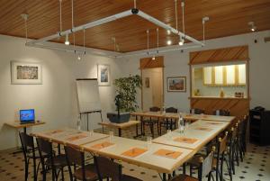 a large room with a long table and chairs at Hotel Atlantique in Le Palais