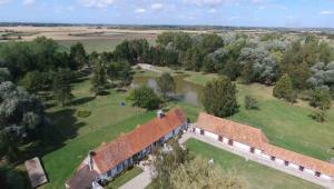 an aerial view of a building in a field at Les Portes des Froises in Saint-Quentin-en-Tourmont