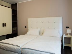 Postel nebo postele na pokoji v ubytování Hotel Asterix