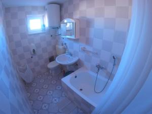 Koupelna v ubytování Orange city apartment's Repić