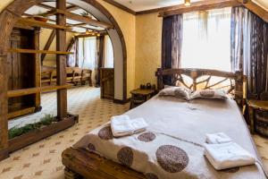 Ένα ή περισσότερα κρεβάτια σε δωμάτιο στο Complex Hyzhky