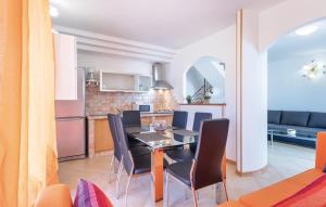 a kitchen and dining room with a table and chairs at Istriana house in Banjole