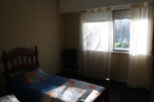 En eller flere senge i et værelse på Quinta Siete Soles