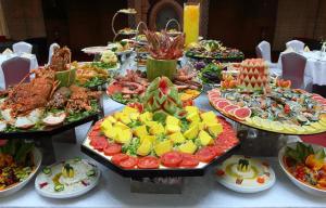 a buffet with many plates of food on a table at Petra Sella Hotel in Wadi Musa