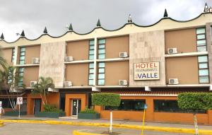 a hotel with a sign on the front of it at Hotel del Valle in Culiacán