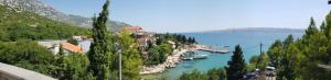 a view of a lake with boats in the water at Apartments Akiki in Karlobag