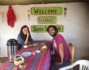a man and a woman sitting at a table at Uros Suyawi Titicaca Lodge in Puno +46 photos